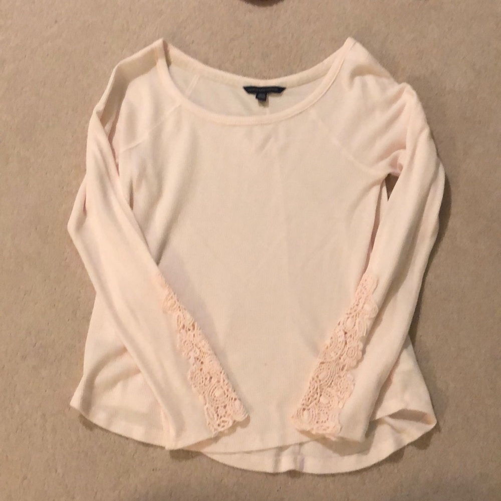 Light pink top with lacy sleeves